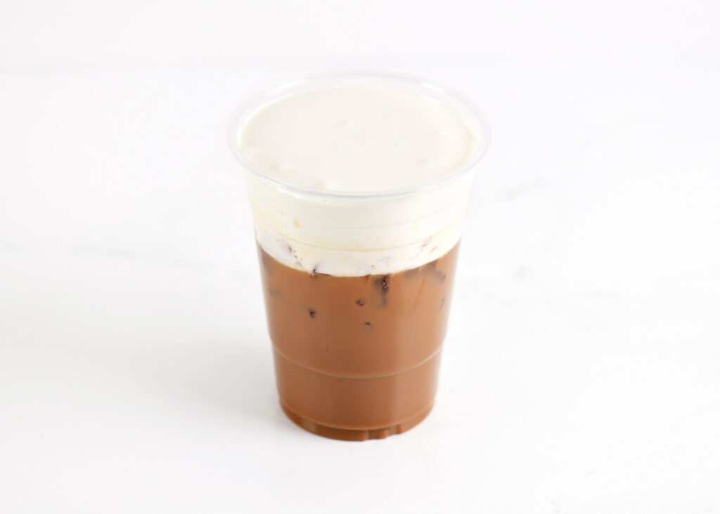 An Espresso in a plastic cup.