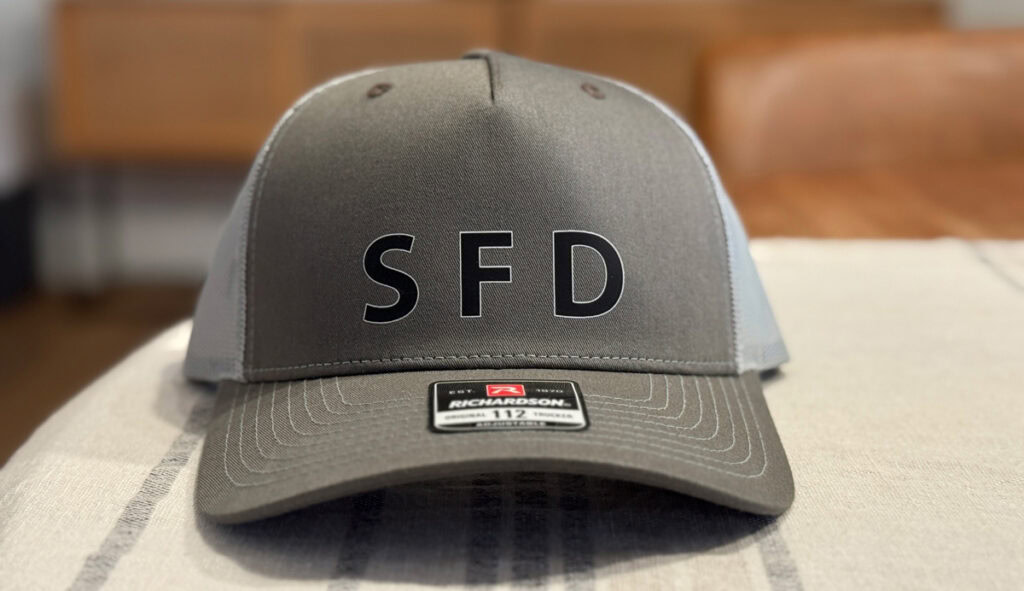 A trucker hat with SFD on the front.